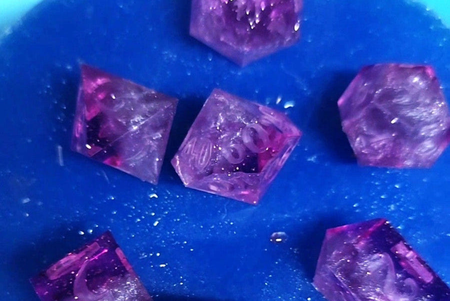 Purple dice on a blue dice mold cap